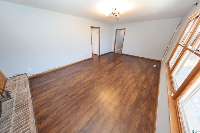 empty room featuring dark wood-type flooring