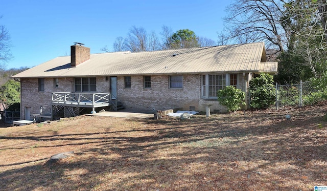 rear view of house with a deck