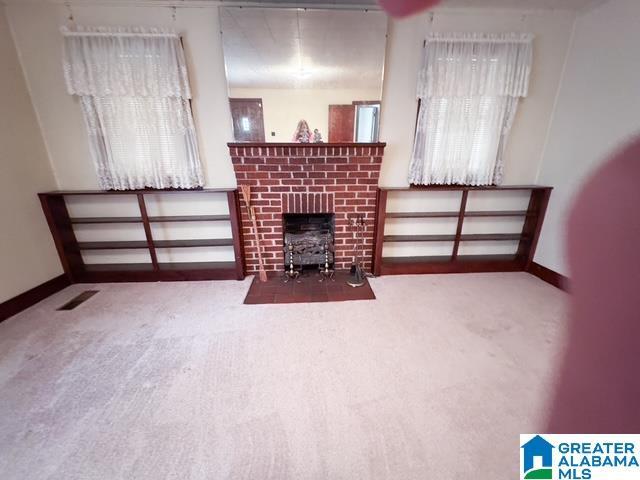 unfurnished living room with carpet floors