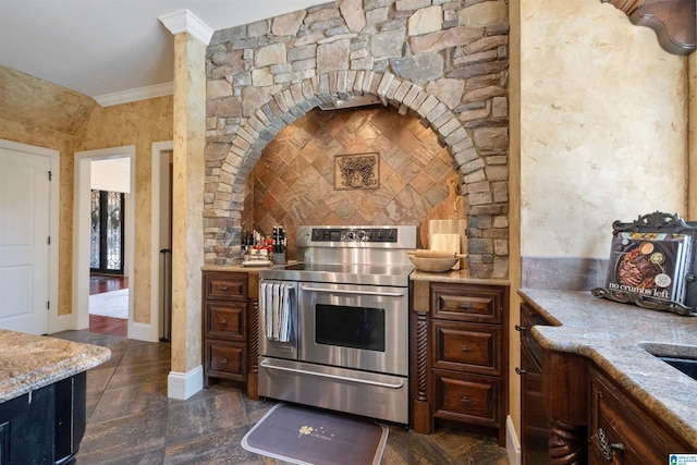 kitchen with crown molding, stainless steel electric stove, light stone countertops, and dark brown cabinets