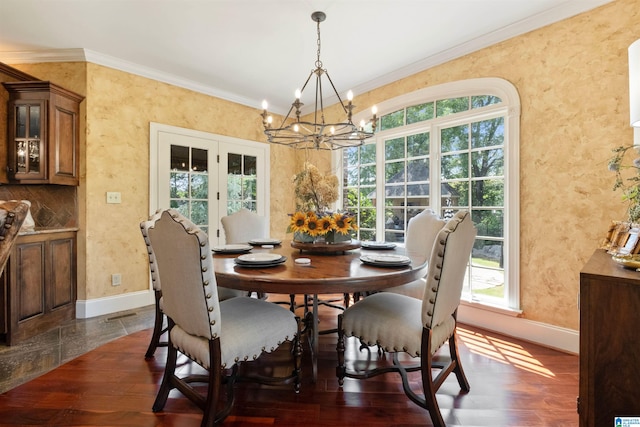 dining area featuring an inviting chandelier, crown molding, and dark wood-type flooring