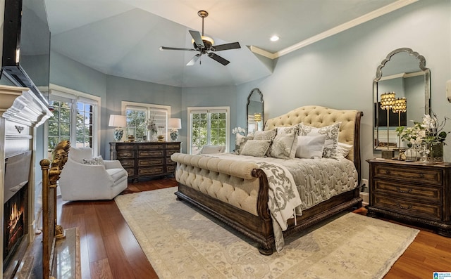 bedroom with crown molding, hardwood / wood-style flooring, ceiling fan, access to outside, and vaulted ceiling