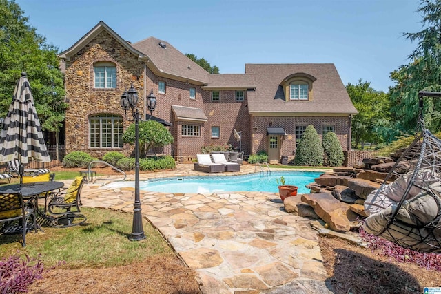 view of pool featuring a patio