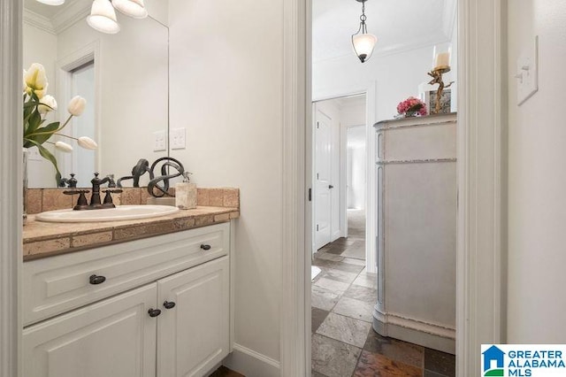 bathroom with vanity and crown molding