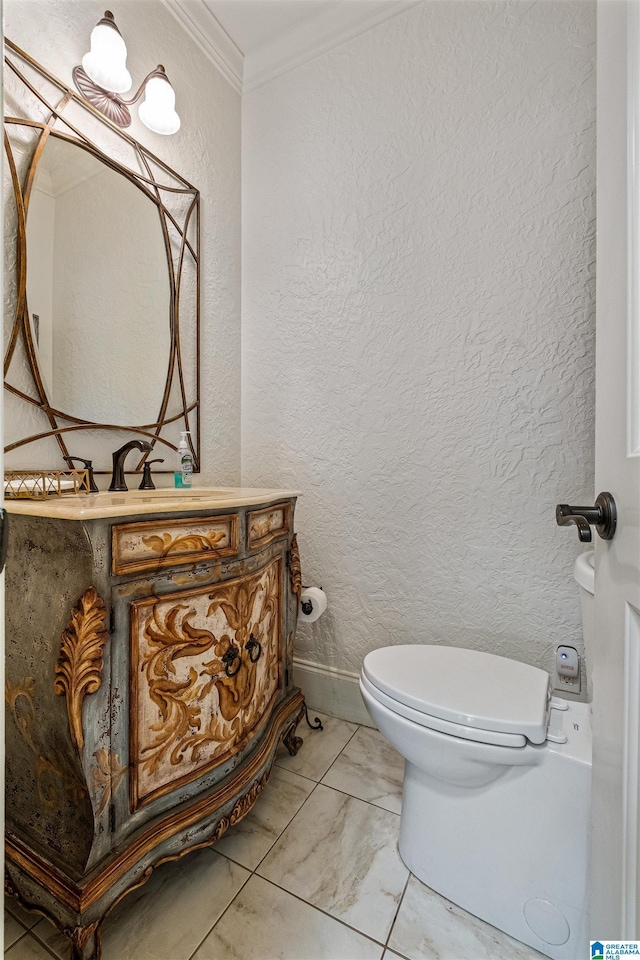 bathroom featuring vanity, ornamental molding, and toilet