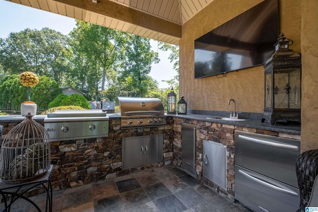 view of patio / terrace featuring a gazebo, an outdoor kitchen, sink, and grilling area