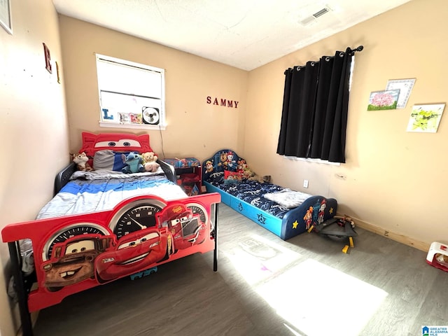 bedroom featuring hardwood / wood-style flooring