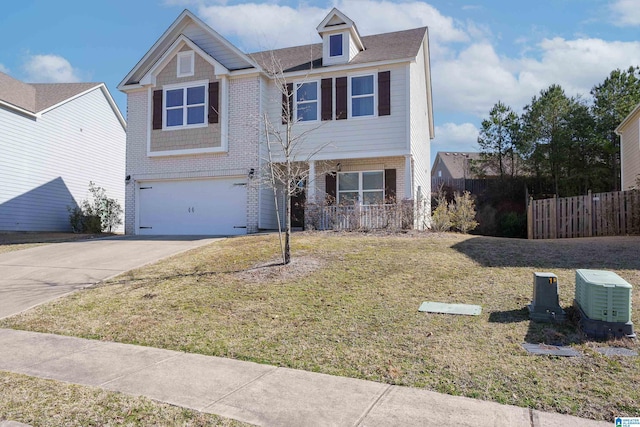 view of front of home with a garage and a front lawn