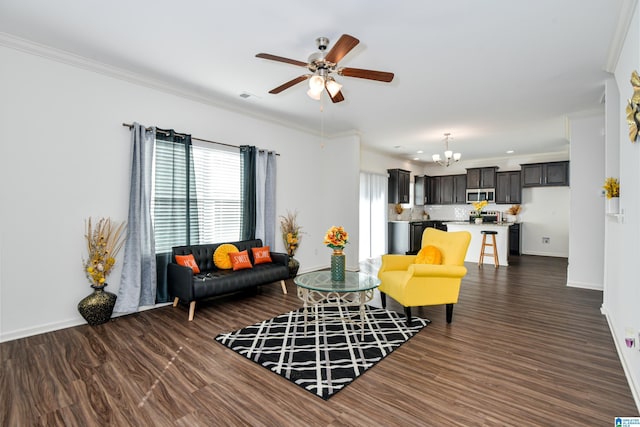 living room featuring crown molding, ceiling fan with notable chandelier, and dark wood-type flooring