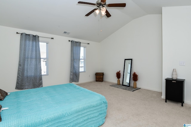 carpeted bedroom with ceiling fan and lofted ceiling