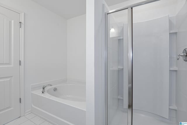 bathroom with separate shower and tub