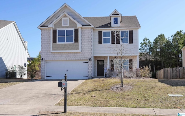 view of front of property with a garage and a front lawn