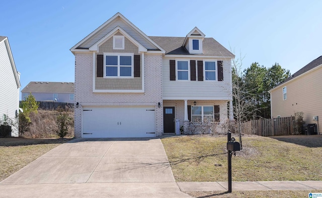 view of front of property with a garage, cooling unit, and covered porch