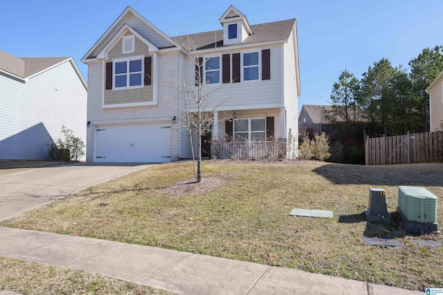 view of front of house with a garage and a front yard