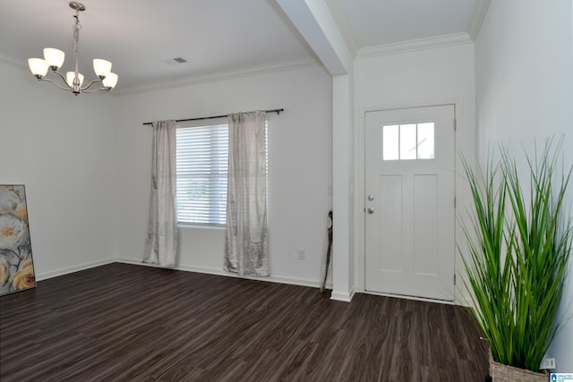 entrance foyer featuring an inviting chandelier, ornamental molding, a healthy amount of sunlight, and dark hardwood / wood-style floors