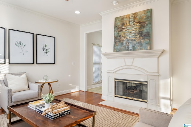 living room featuring hardwood / wood-style flooring and ornamental molding