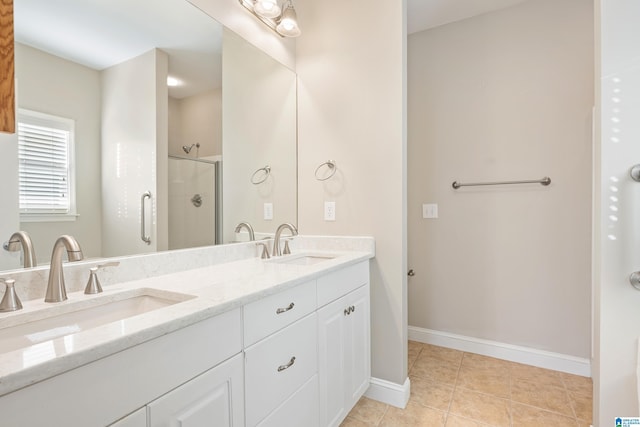 bathroom featuring vanity, tile patterned floors, and walk in shower