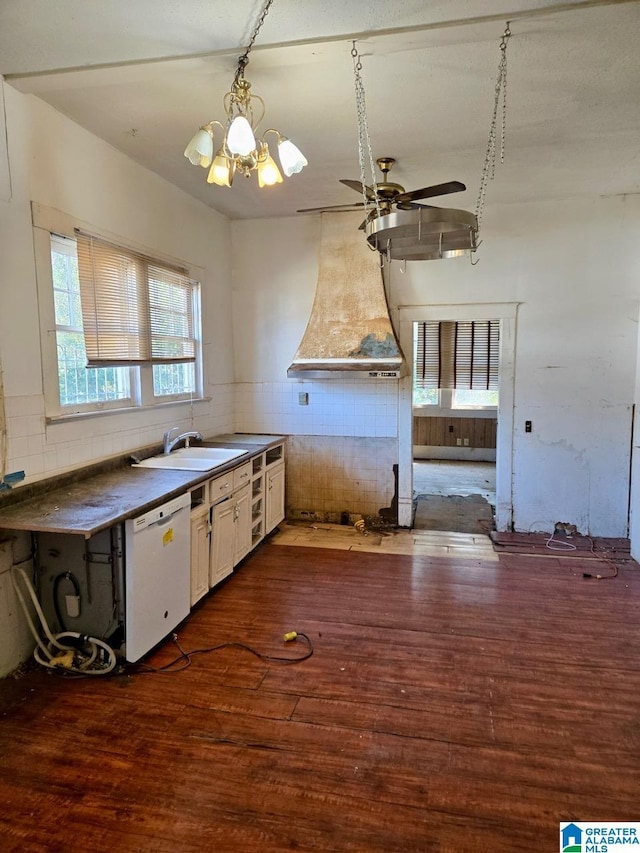 kitchen featuring sink, white cabinetry, white dishwasher, dark hardwood / wood-style flooring, and custom range hood