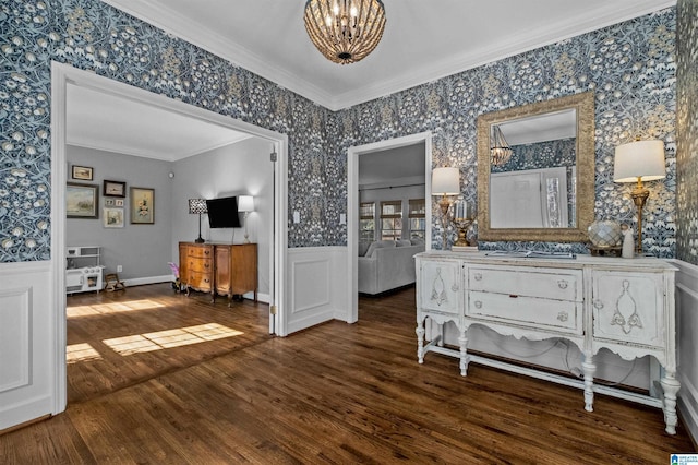 interior space featuring crown molding, wood-type flooring, and an inviting chandelier