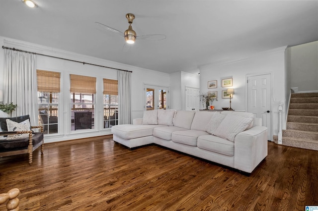 living room with ceiling fan, ornamental molding, and dark hardwood / wood-style flooring