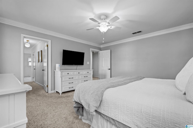 carpeted bedroom featuring ceiling fan, ornamental molding, and ensuite bath