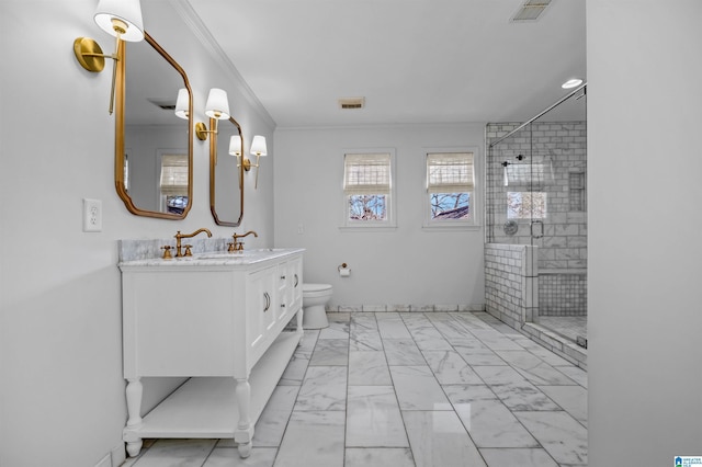 bathroom with vanity, ornamental molding, a shower with door, and toilet