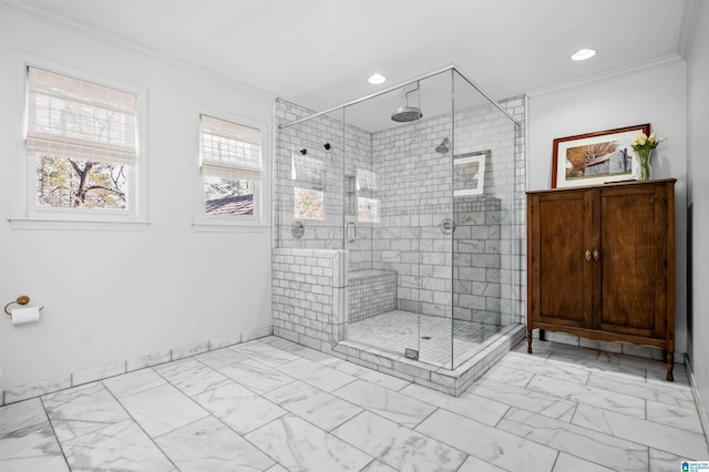 bathroom featuring crown molding and a shower with shower door