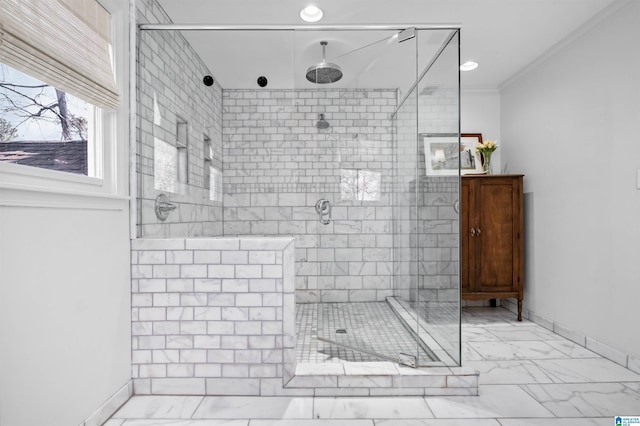 bathroom with ornamental molding and an enclosed shower