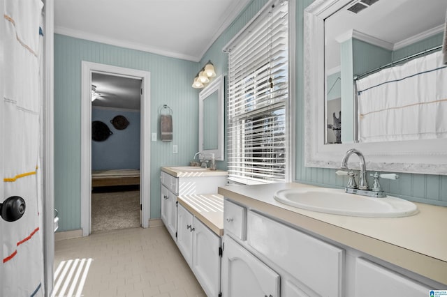 bathroom with crown molding and vanity