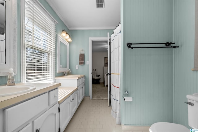 bathroom with crown molding, toilet, tile patterned floors, and vanity