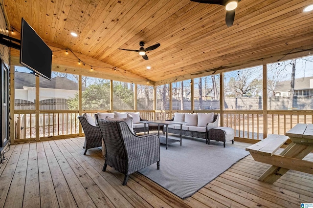 sunroom with vaulted ceiling, wooden ceiling, and ceiling fan