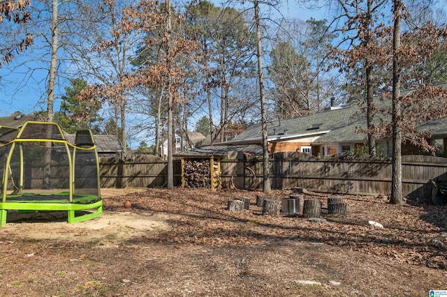 view of yard with a trampoline