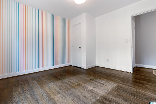 empty room featuring wood-type flooring