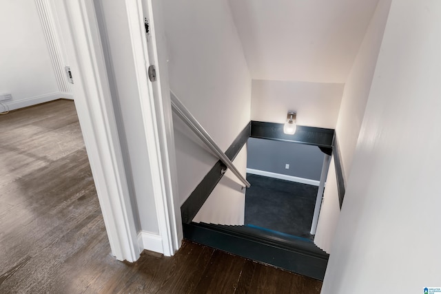 stairway featuring hardwood / wood-style flooring