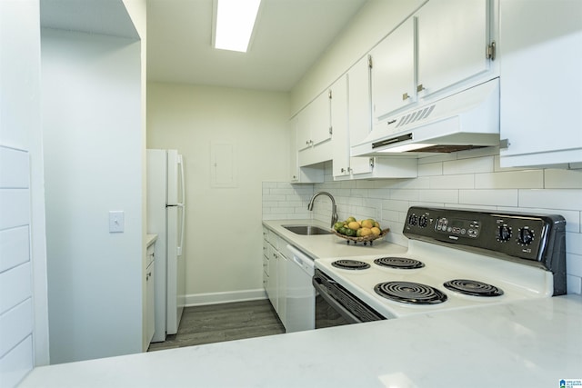 kitchen featuring sink, dark hardwood / wood-style flooring, white appliances, decorative backsplash, and white cabinets