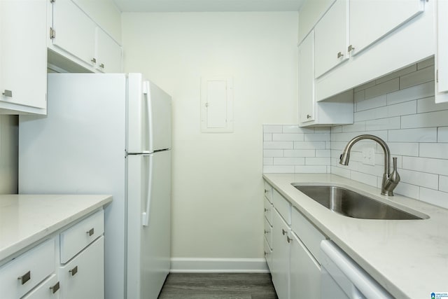 kitchen featuring sink, white cabinets, white appliances, and decorative backsplash