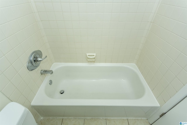 bathroom with tile patterned floors and toilet