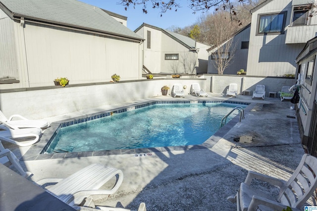 view of swimming pool with a patio