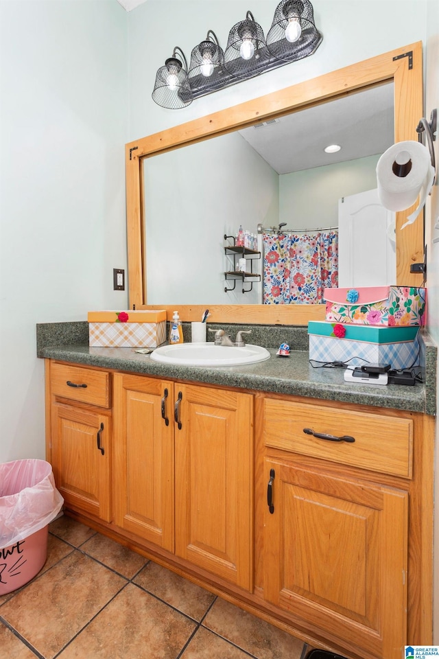 bathroom with vanity and tile patterned flooring