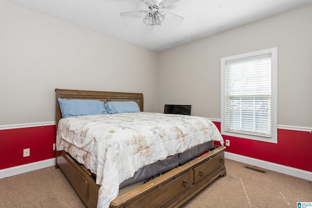 bedroom featuring light carpet and ceiling fan