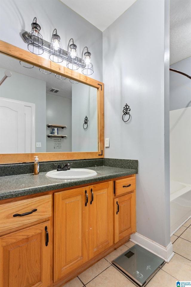 bathroom featuring vanity and tile patterned flooring