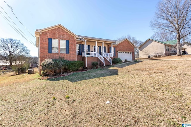 single story home with a porch, a garage, central air condition unit, and a front lawn