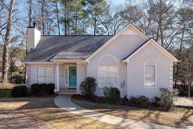 ranch-style home with a front yard