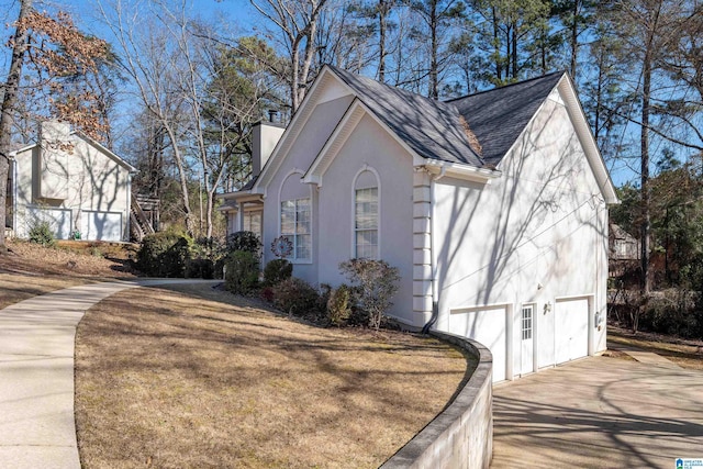 view of home's exterior with a lawn