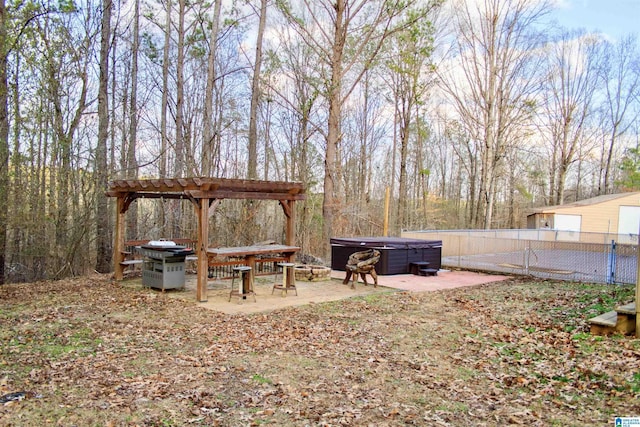 view of yard with a pergola, a hot tub, and a patio