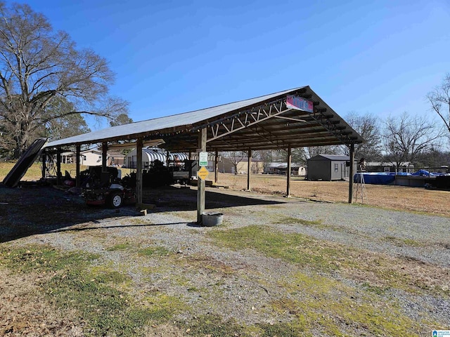 view of vehicle parking with a carport