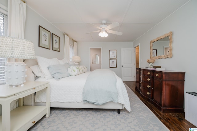 bedroom with dark hardwood / wood-style floors and ceiling fan