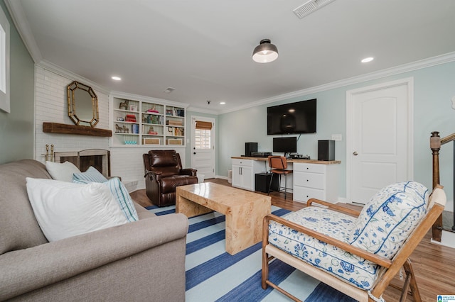 living room featuring hardwood / wood-style flooring and ornamental molding