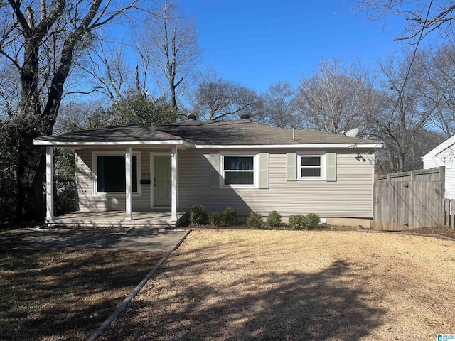 view of front of house with a front yard and a porch