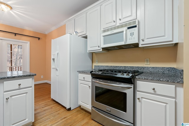 kitchen featuring white appliances, ornamental molding, light hardwood / wood-style floors, and white cabinets